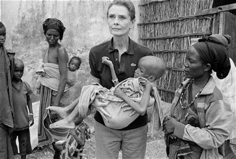 audrey hepburn helping children.